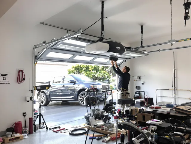 Upper Arlington Garage Door Repair specialist installing smart garage door opener system in Upper Arlington home